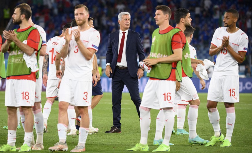 Switzerland&#039;s head coach Vladimir Petkovic, center, looks disapointed in middle of Swiss players after loosing the Euro 2020 soccer tournament group A match between Italy and Switzerland at the O ...