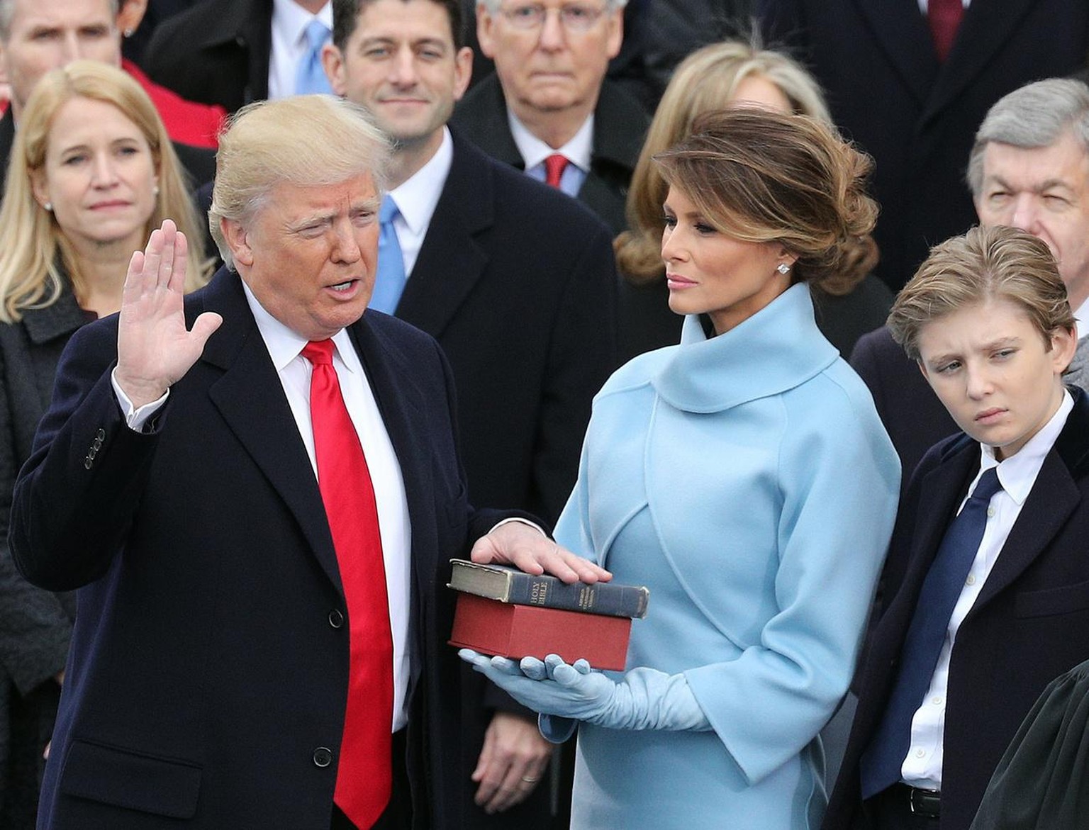 epa06254056 YEARENDER 2017 JANUARY .President-elect Donald J. Trump (L) takes the oath of office as the 45th President of the United States in Washington, DC, USA, 20 January 2017. Trump won the 08 No ...