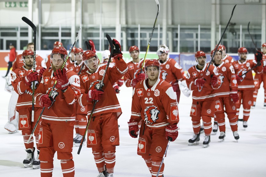 Lausanne&#039;s players celebrate after winning against Yunost Minsk, during the Champions Hockey League game between Lausanne HC and Yunost Minsk, at the ice stadium Yverdon, in Yverdon-Las-Bains, Sw ...
