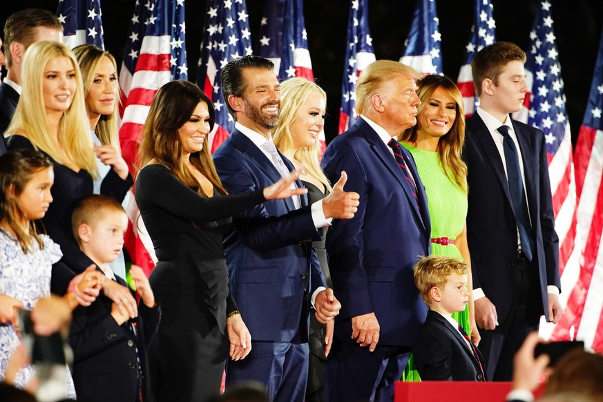 epa08630590 Members of the Trump family join US president Donald J. Trump (3R) US First Lady Melania Trump (2R) and Barron Trump (R) after Trump delivered his acceptance speech on the final night of t ...