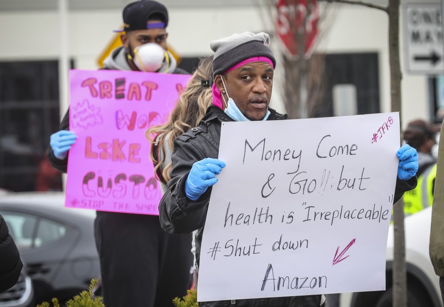 Gerald Bryson, left, join workers at an Amazon fulfillment center in Staten Island, N.Y., protesting conditions in the company&#039;s warehouse, Monday March 30, 2020, in New York. Workers say Amazon  ...