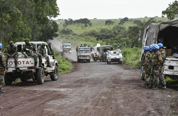epaselect epa09030027 United Nations and Congo Armed Forces soldiers secure a road near the scene of an attack on the edge of the Virunga National Park where Italy&#039;s ambassador to the Democratic  ...