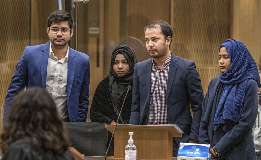 Mohammad Alam, second right, makes his victim impact statement during the sentencing hearing for Australian Brenton Harrison Tarrant at the Christchurch High Court after Tarrant pleaded guilty to 51 c ...