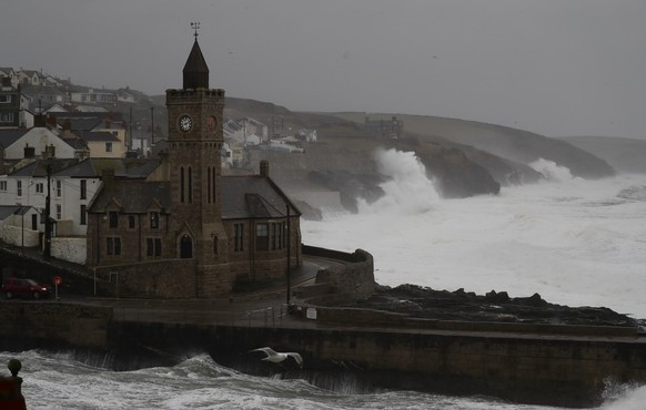 Powerful waves break on the shoreline around the small port of Porthleven, south west England, Sunday, Feb. 16, 2020. Storm Dennis roared across Britain on Sunday, lashing towns and cities with high w ...