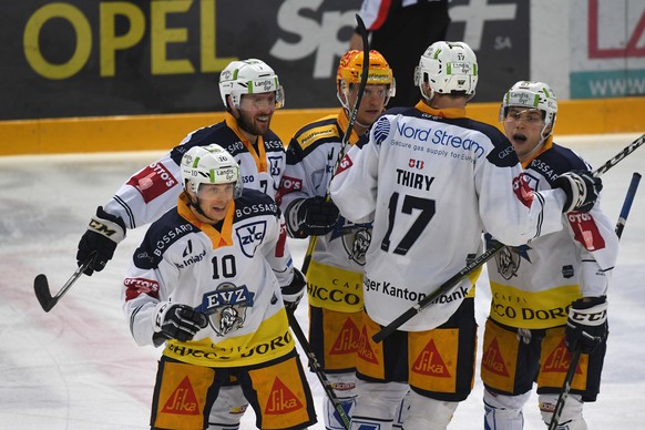 Zug&#039;s players celebrate the 0-3 during the second leg of the playoff quarterfinals of the ice hockey National League Swiss Championship between HC Lugano and EV Zug, at the ice stadium Corner Are ...