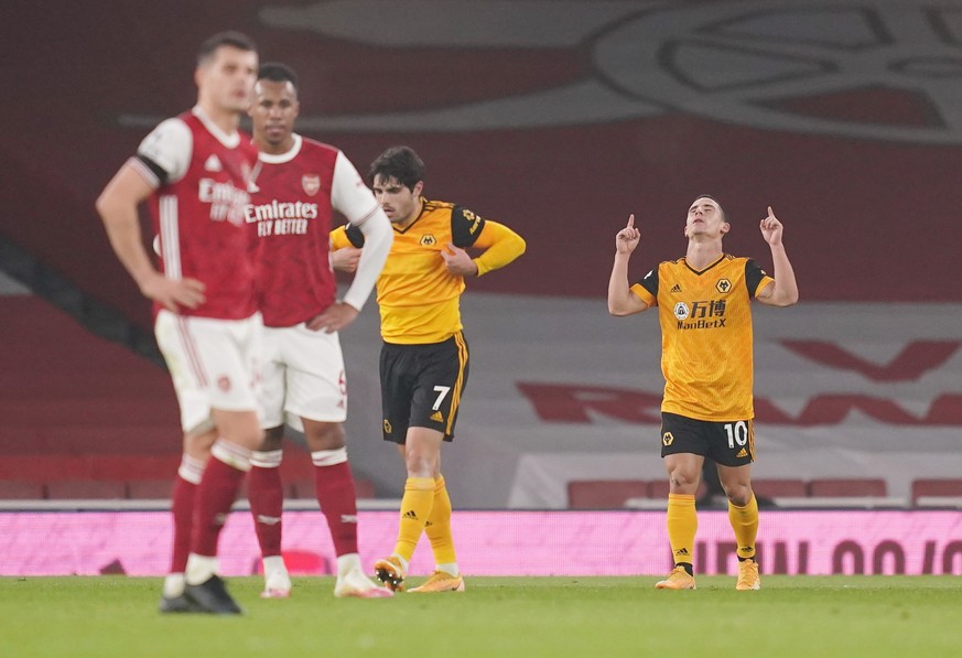 epa08851939 Daniel Podence of Wolverhampton (R) celebrates scoring his team&#039;s second goal during the English Premier League soccer match between Arsenal FC and Wolverhampton Wanderers in London,  ...