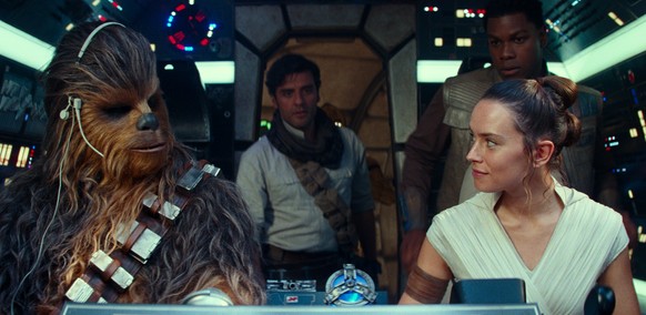 This image released by Disney/Lucasfilm shows, from left, Joonas Suotamo as Chewbacca, Oscar Isaac as Poe Dameron, Daisy Ridley as Rey and John Boyega as Finn in a scene from &quot;Star Wars: The Rise ...