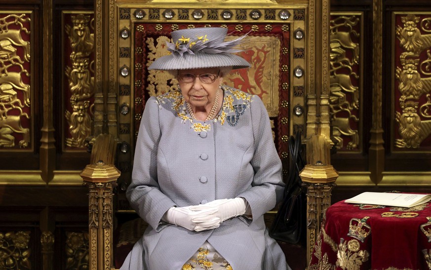 Britain&#039;s Queen Elizabeth II delivers a speech in the House of Lords during the State Opening of Parliament at the Palace of Westminster in London, Tuesday May 11, 2021. (Chris Jackson/Pool via A ...