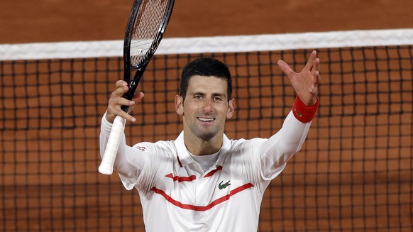 epa08718496 Novak Djokovic of Serbia reacts after winning against Daniel Elahi Galan of Colombia in their men?s third round match during the French Open tennis tournament at Roland ?Garros in Paris, F ...