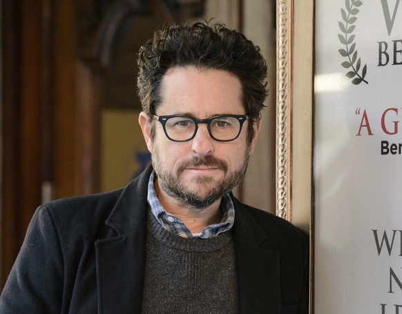 FILE - In this March 2, 2017 file photo, director-producer J.J. Abrams poses for a portrait to promote &quot;The Play That Goes Wrong&quot; at the Lyceum Theatre in New York. Abrams says he will use u ...