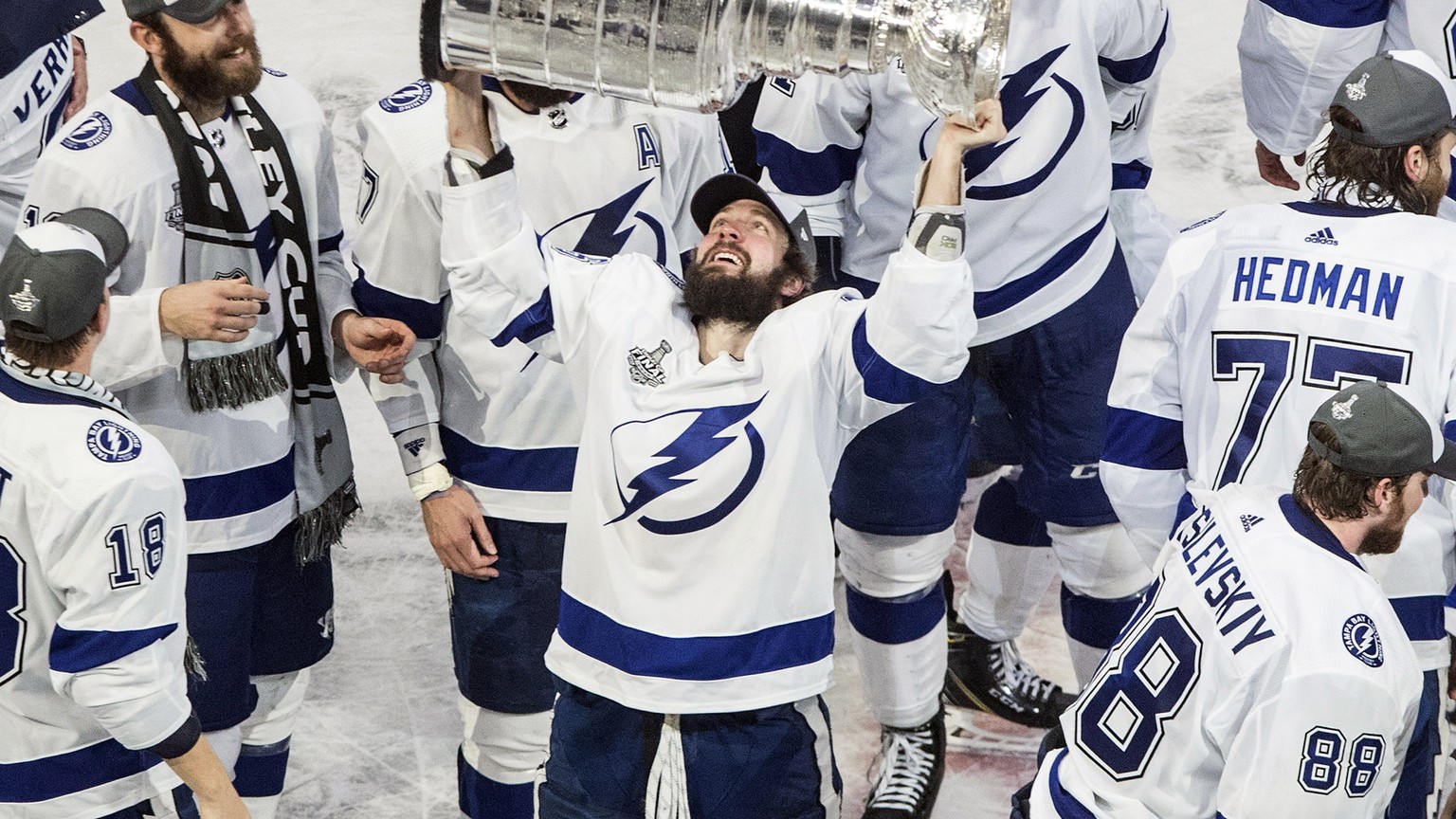FILE - In this Sept. 28, 2020, file photo, Tampa Bay Lightning&#039;s Nikita Kucherov (86) hoists the Stanley Cup after defeating the Dallas Stars in the NHL Stanley Cup hockey finals, in Edmonton, Al ...