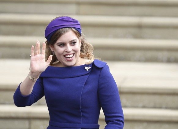FILE - In this Friday Oct. 12, 2018 file photo, Britain&#039;s Princess Beatrice arrives for the wedding of Princess Eugenie of York and Jack Brooksbank at St George&#039;s Chapel, Windsor Castle, nea ...
