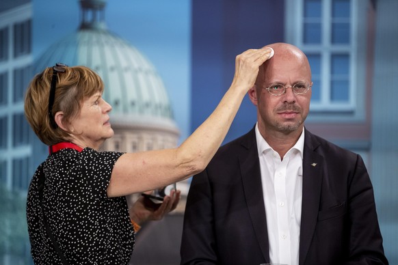 epa08424406 (FILE) - Brandenburg chairman and top candidate of the Alternative for Germany (AfD) right-wing populist party Andreas Kalbitz receives a powder treatment during a TV program during the Br ...