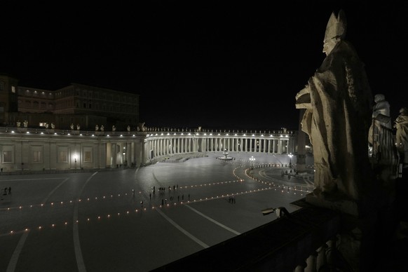 Pope Francis presides over the Via Crucis (Way of the Cross) ceremony in St. Peter&#039;s Square, at the Vatican, Friday, Friday, April 2, 2021. (AP Photo/Gregorio Borgia, Pool)