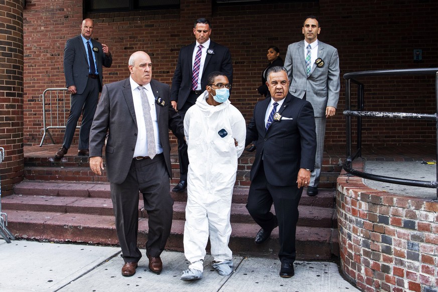 Tyrese Haspil, 21, is escorted out of the 7th precinct by NYPD detectives, Friday, July 17, 2020, in New York.