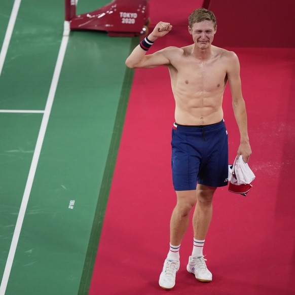 Denmark&#039;s Victor Axelsen celebrates after winning against China&#039;s Chen Long during their men&#039;s singles gold medal Badminton match at the 2020 Summer Olympics, Monday, Aug. 2, 2021, in T ...