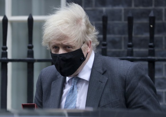 Britain&#039;s Prime Minister Boris Johnson leaves 10 Downing Street to attend the weekly Prime Ministers&#039; Questions session in parliament in London, Wednesday, Feb. 10, 2021. (AP Photo/Kirsty Wi ...