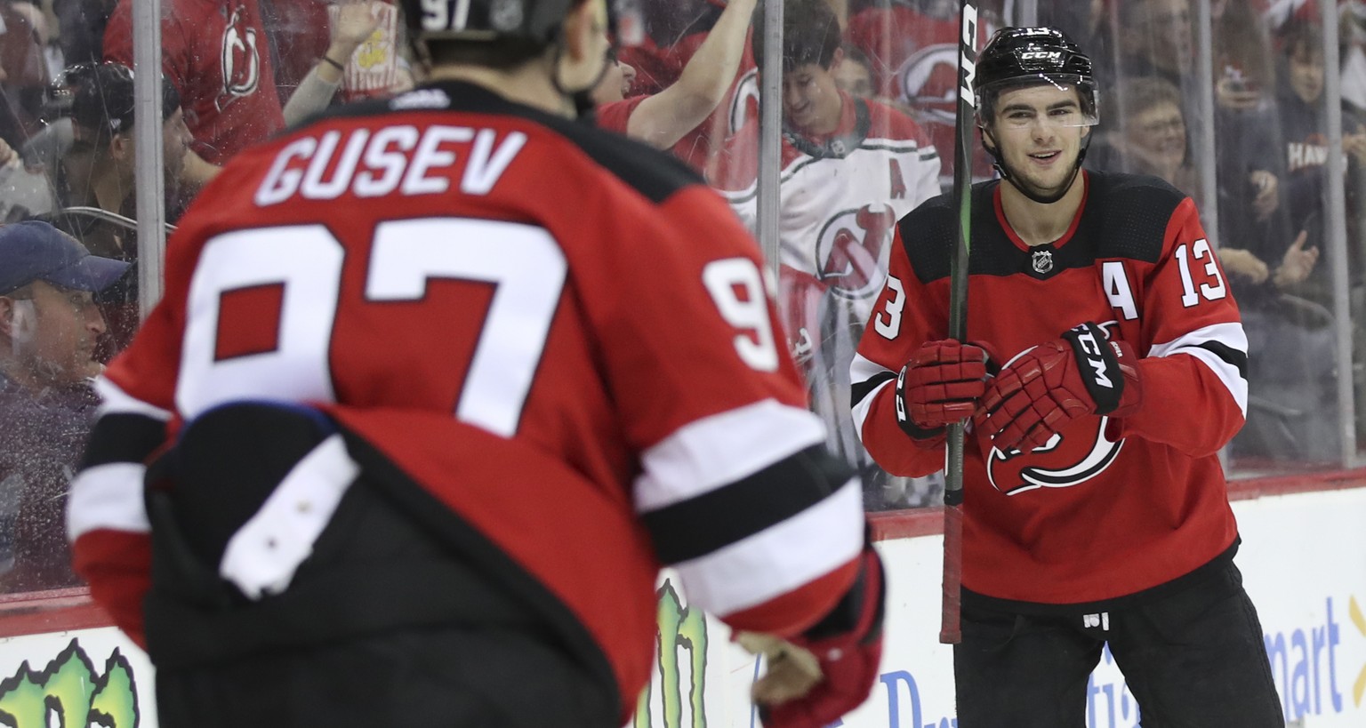 New Jersey Devils left wing Nikita Gusev (97) celebrates after scoring a goal with center Nico Hischier (13) during the second period of a preseason NHL hockey game, Saturday, Sept. 21, 2019, in Newar ...