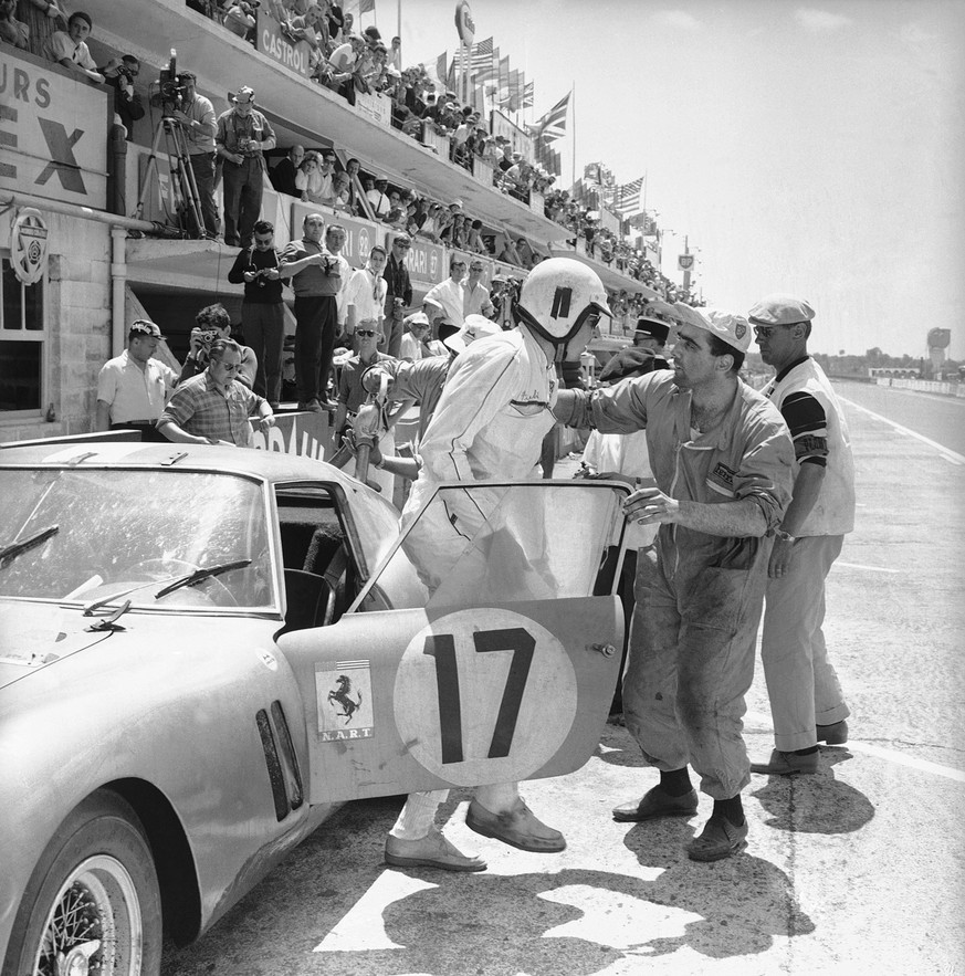 Glenn Roberts of the North American Racing Team gets out of his Ferrari during the Le Mans auto race June 25, 1962. (AP Photo)
