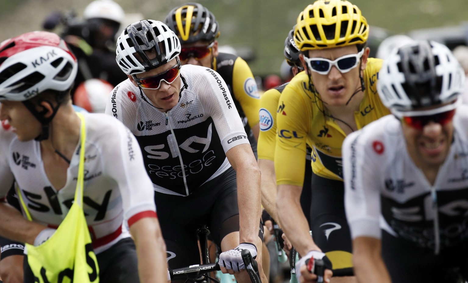 epa06914063 Team Sky rider Chris Froome (L) of Britain and Geraint Thomas (R) in action with the pack of riders during the 19th stage of the 105th edition of the Tour de France cycling race over 200.5 ...