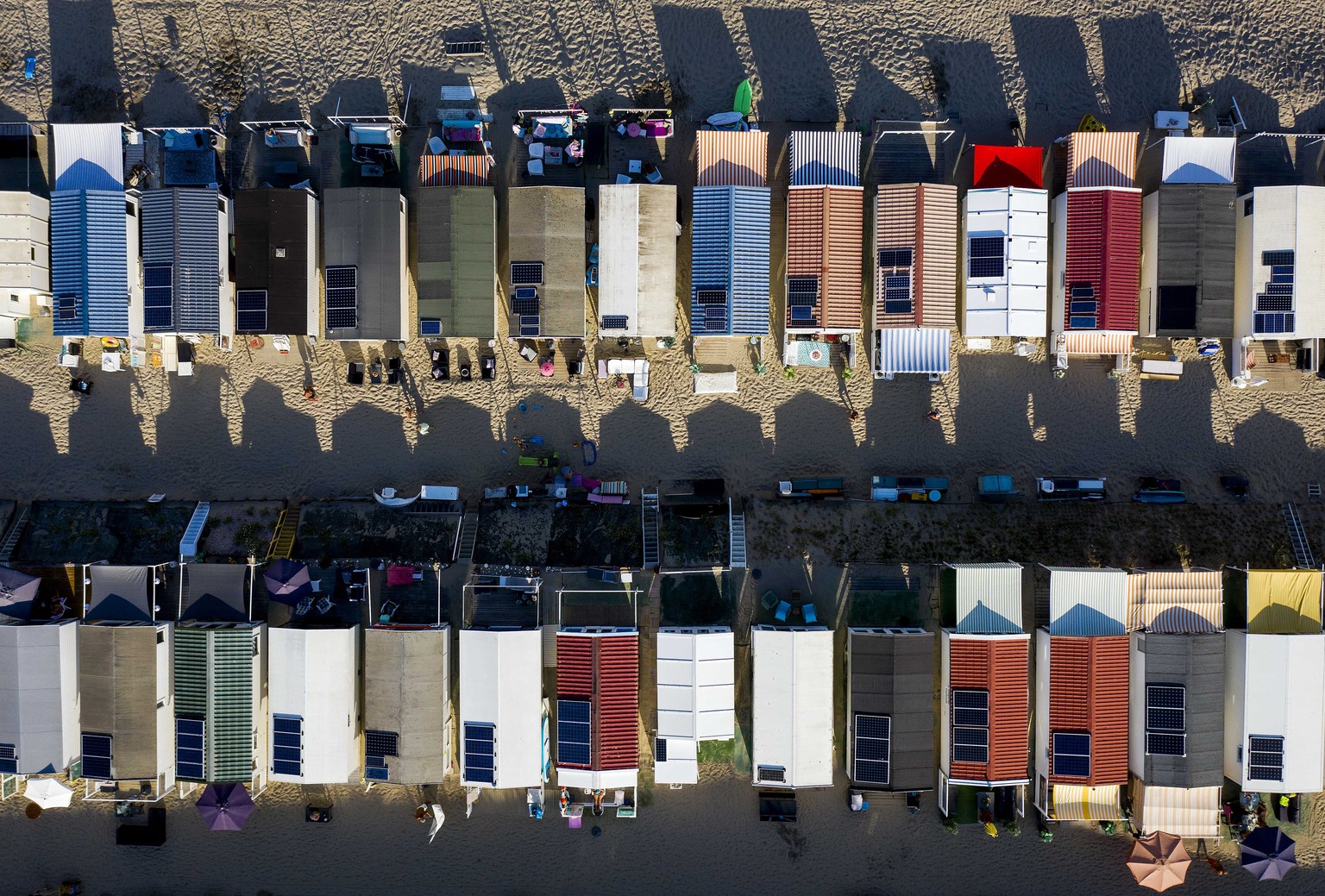 epaselect epa08591596 An aerial view taken with a drone shows beach houses on the beach in Zandvoort, The Netherlands, 08 August 2020. Now that a period of sunny and hot summer weather has arrived, pe ...