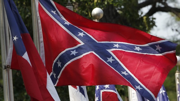 FILE - In this July 19, 2011 file photo, Confederate battle flags fly in Mountain Creek, Ala. The House has voted to ban the display of the Confederate flag on flagpoles at Veterans Administration cem ...