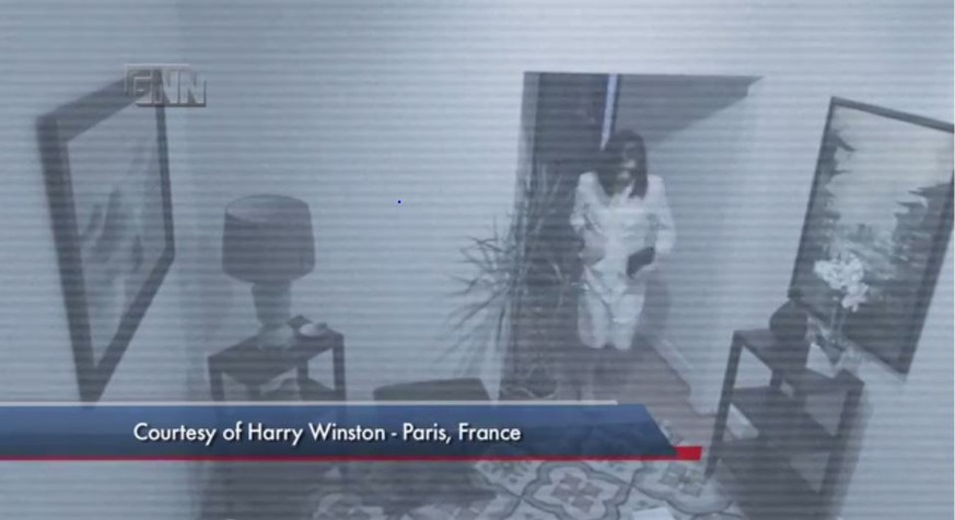 Einer der als Frau verkleideten Täter des Überfalls auf die Pariser Filiale des Juweliers Harry Winston