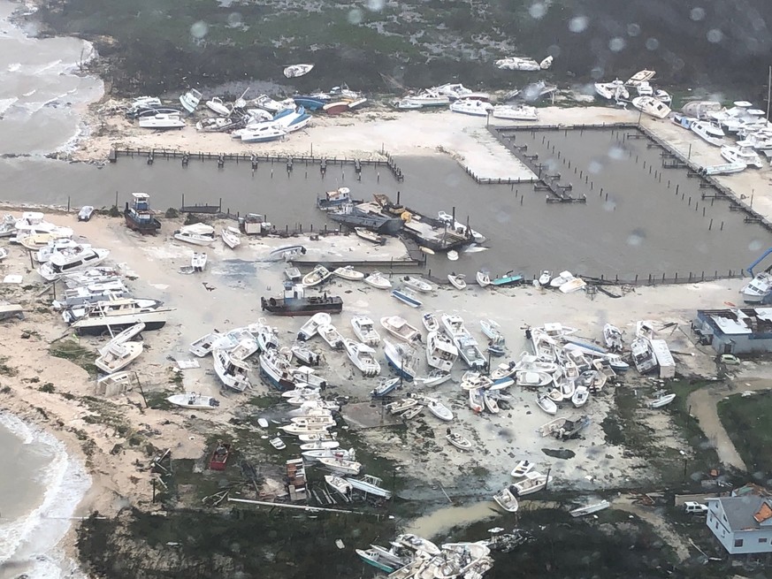 epa07814882 A handout aerial view taken by Coast Guard Air Station Clearwater forward-deployed four MH-60 Jayhawk helicopter crew in support of search and rescue and humanitarian aid in the Bahamas, 0 ...