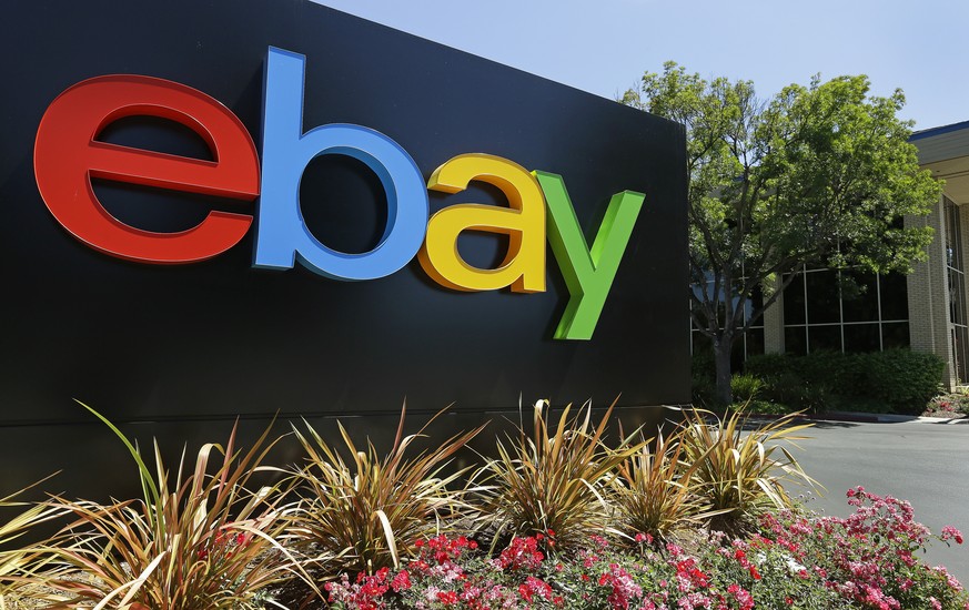 FILE - This Tuesday, July 16, 2013, file photo shows signage at eBay headquarters in San Jose, Calif. Six former eBay Inc. employees were arrested and charged Monday, June 15, 2020, with waging an ext ...
