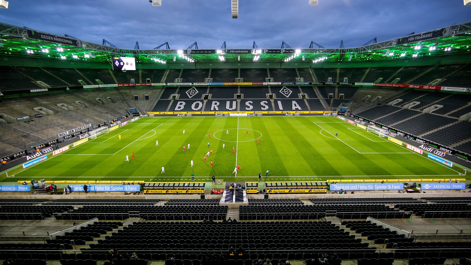 epa08286775 View of empty stands during the German Bundesliga soccer match between Borussia Moenchengladbach and 1. FC Koeln in Moenchengladbach, Germany, 11 March 2020. he match takes place behind cl ...