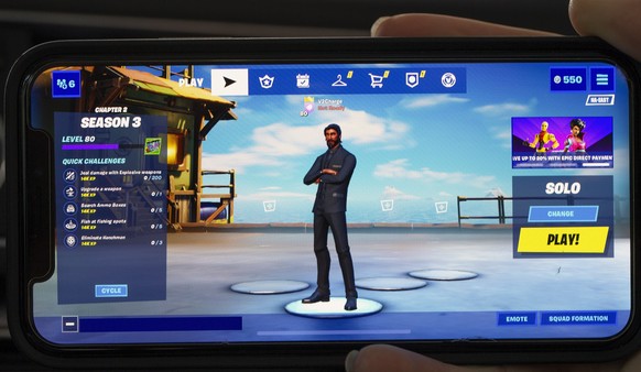 epa08623375 The &#039;launch screen&#039; of the video game Fortnite, seen on an Apple iPhone X in Billerica, Massachusetts, USA, 24 August 2020. Epic Games Inc., the maker of the popular game Fortnit ...