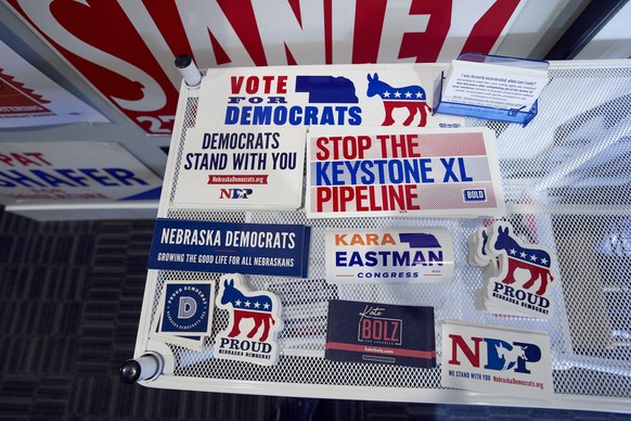 In this June 22, 2020, photo, various campaign stickers are available at the Lancaster County Democratic Party offices in Lincoln, Neb. Even as Democrats are seeing registration gains in other states, ...