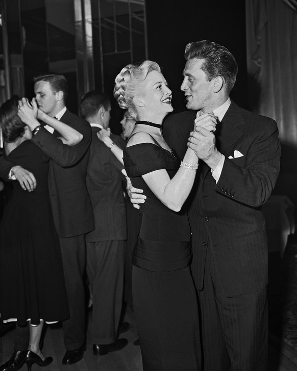 FILE -- This May 7, 1949 file photo shows actor Kirk Douglas, right, dancing with Marilyn Maxwell at the Stork Club, in New York. (AP Photo, File)