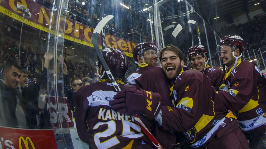 Geneve-Servette&#039;s players celebrate after winning against Ambri-Piotta, during a National League regular season game of the Swiss Championship between Geneve-Servette HC and HC Ambri-Piotta, at t ...