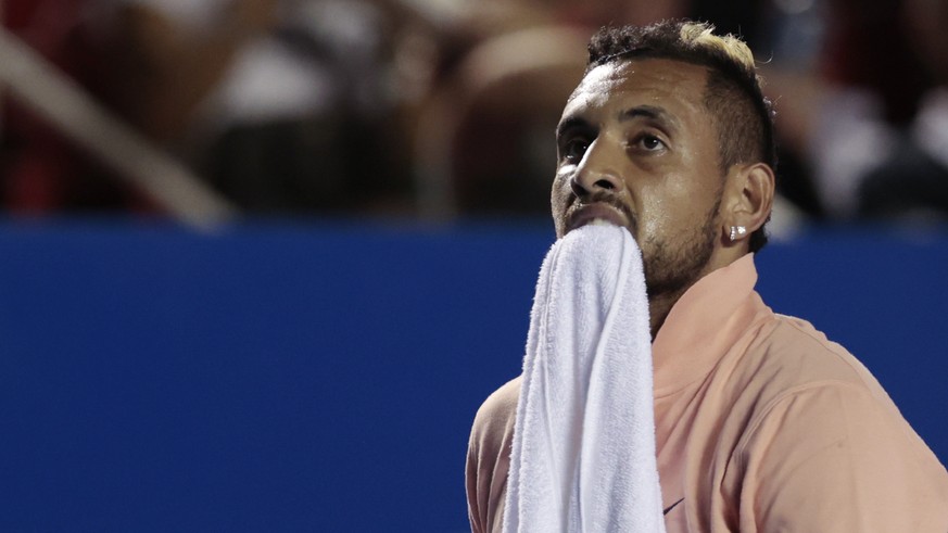 Australia&#039;s Nick Kyrgios carries a towel between his teeth during an opening-round match against France&#039;s Ugo Humbert at the Mexican Open tennis tournament in Acapulco, Mexico, Tuesday, Feb. ...