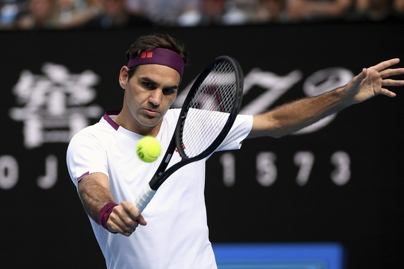 FILE - In this Jan. 28, 2020, file photo, Switzerland&#039;s Roger Federer makes a backhand return to Tennys Sandgren, of the United States, during their quarterfinal match at the Australian Open tenn ...