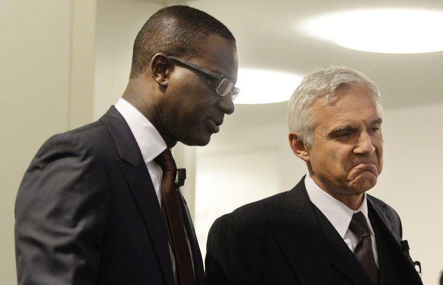Tidjane Thiam, left, CEO of Swiss bank Credit Suisse and Chairman of Swiss bank Credit Suisse Urs Rohner, right, during a press conference in Zurich, Switzerland, Wednesday, October 21, 2015. Credit S ...