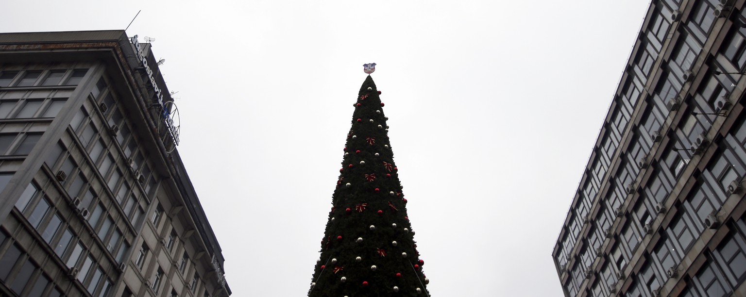 The Belgrade&#039;s official Christmas tree decorated with city coat of arms stands in main pedestrian street in downtown Belgrade, Serbia, Friday, Dec. 22, 2017. The city authorities in Serbia&#039;s ...