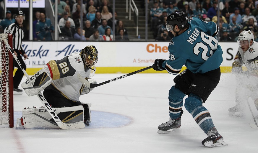 Vegas Golden Knights goalie Marc-Andre Fleury, left, blocks a shot from San Jose Sharks&#039; Timo Meier (28) during the first period of Game 5 of an NHL hockey first-round playoff series Thursday, Ap ...