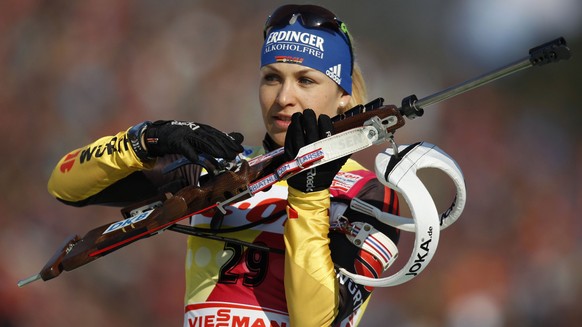 Magdalena Neuner of Germany prepares for a warm up shooting prior to the Women&#039;s 7.5 km Sprint competition at the Biathlon World Championships in Ruhpolding, Germany, Saturday, March 3, 2012. (AP ...
