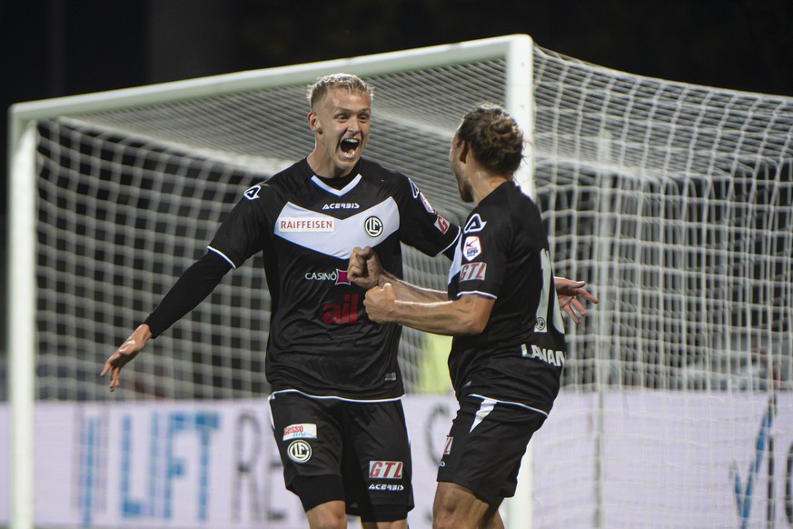 Lugano&#039;s player Jens Odgaard and Lugano&#039;s player Numa Lavanchy, from left, celebrate the 1-0 goal, during the Super League soccer match between FC Lugano and FC St. Gallen, at the Cornaredo  ...