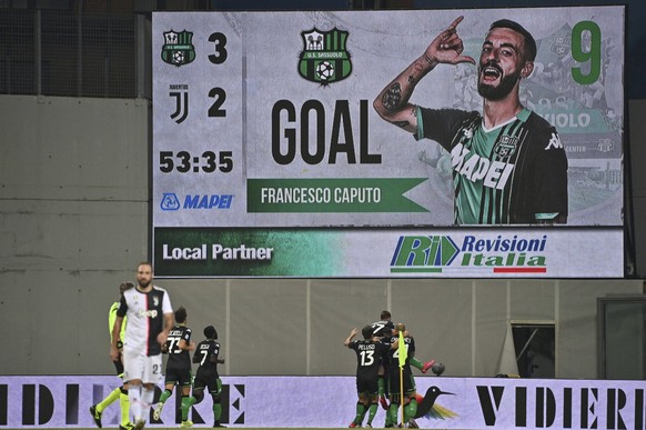 Sassuolo&#039;s Francesco Caputo, hidden, celebrates after scoring a goal during a Serie A soccer match between Sassuolo and Juventus at the Mapei Stadium in Reggio Emilia, Italy, Wednesday, July 15,  ...