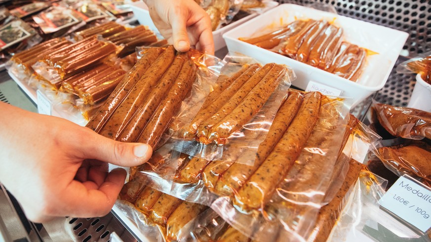 epa07851020 Vegan products are on display at the vegan sausage butcher shop L&#039;herbivore in Berlin, Germany, 17 September 2019 (issued on 18 September 2019). The Sausage skin is made of a special  ...
