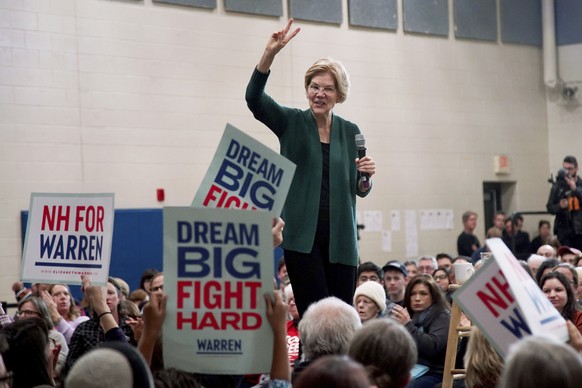 Democratic presidential candidate Sen. Elizabeth Warren, D-Mass., holds up two fingers as she speaks during a campaign stop, Saturday, Nov. 23, 2019, in Manchester, N.H. (AP Photo/Mary Schwalm)