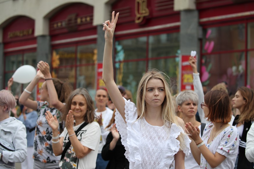 epa08598810 Women stand in chain during a rally to support detained and injured participants of the protests after the presidential election, in Minsk, Belarus, 12 August 2020. Long-time President of  ...