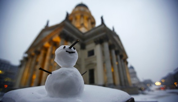 A little snowman is seen at the Gendarmenmarkt square after snow falls in Berlin, Germany, January 7, 2016. REUTERS/Hannibal Hanschke