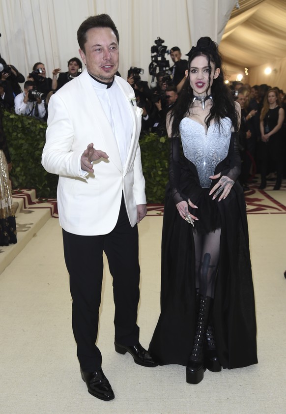 Elon Musk, left and Grimes attend The Metropolitan Museum of Art&#039;s Costume Institute benefit gala celebrating the opening of the Heavenly Bodies: Fashion and the Catholic Imagination exhibition o ...