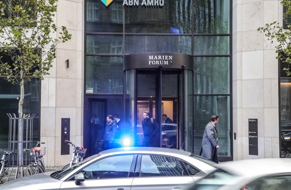 epa08008472 A police car outside at a branch office of ABN AMRO Bank in Frankfurt Main, Germany, 19 November 2019. Police raided the Frankfurt offices of ABN AMRO in connection with investigations inv ...
