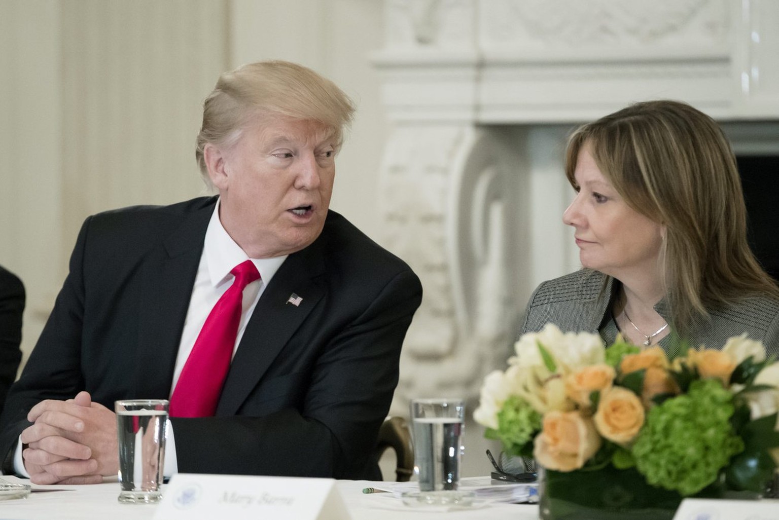 epa05769262 US President Donald J. Trump (L) sits beside CEO of General Motors Company Mary Barra (R), during a forum with business leaders in the State Dining Room of the White House in Washington, D ...