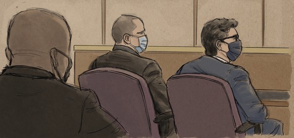 In this courtroom sketch, former Minneapolis police officer Derek Chauvin, center, sits beside his defense attorney during a hearing in Minneapolis, Friday, Sept. 11, 2020. Prosecutors in the case of  ...